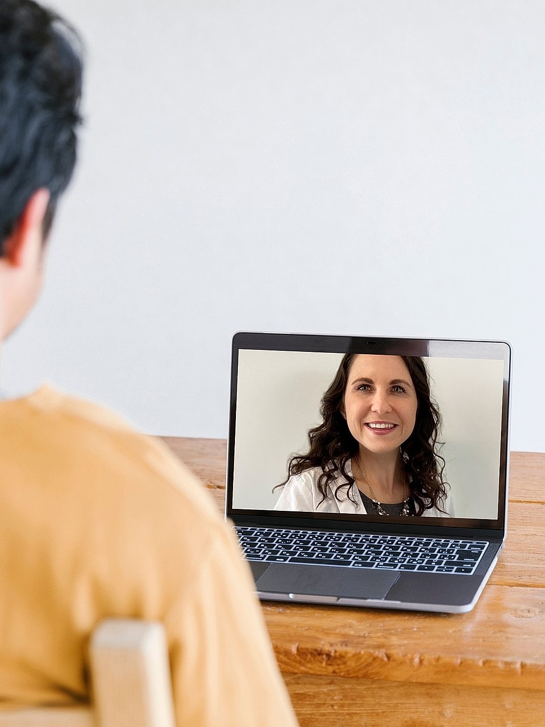 Person video chatting on a laptop.