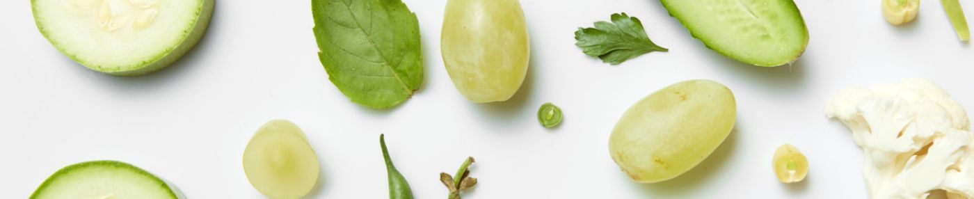 Fresh vegetables and fruits on white background.