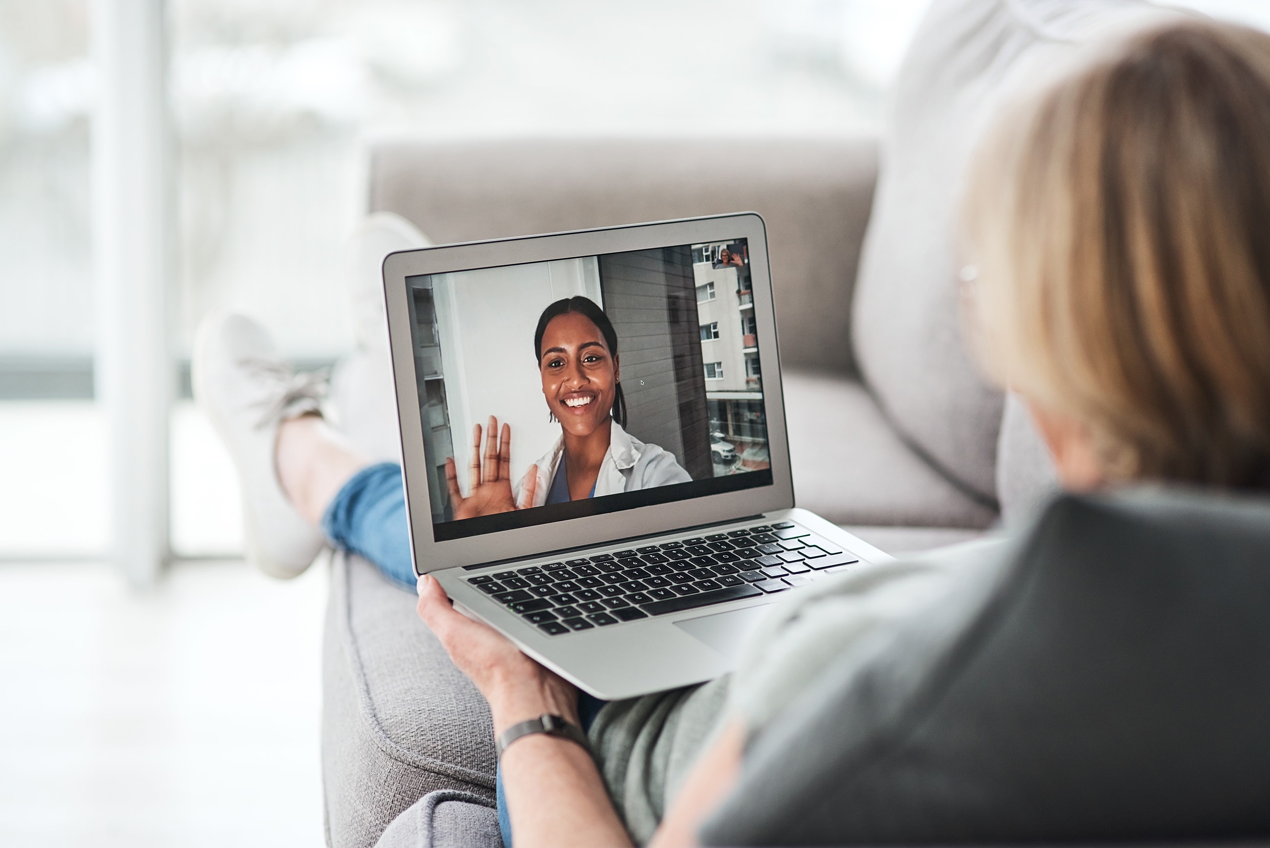 Video call between two people on a laptop.